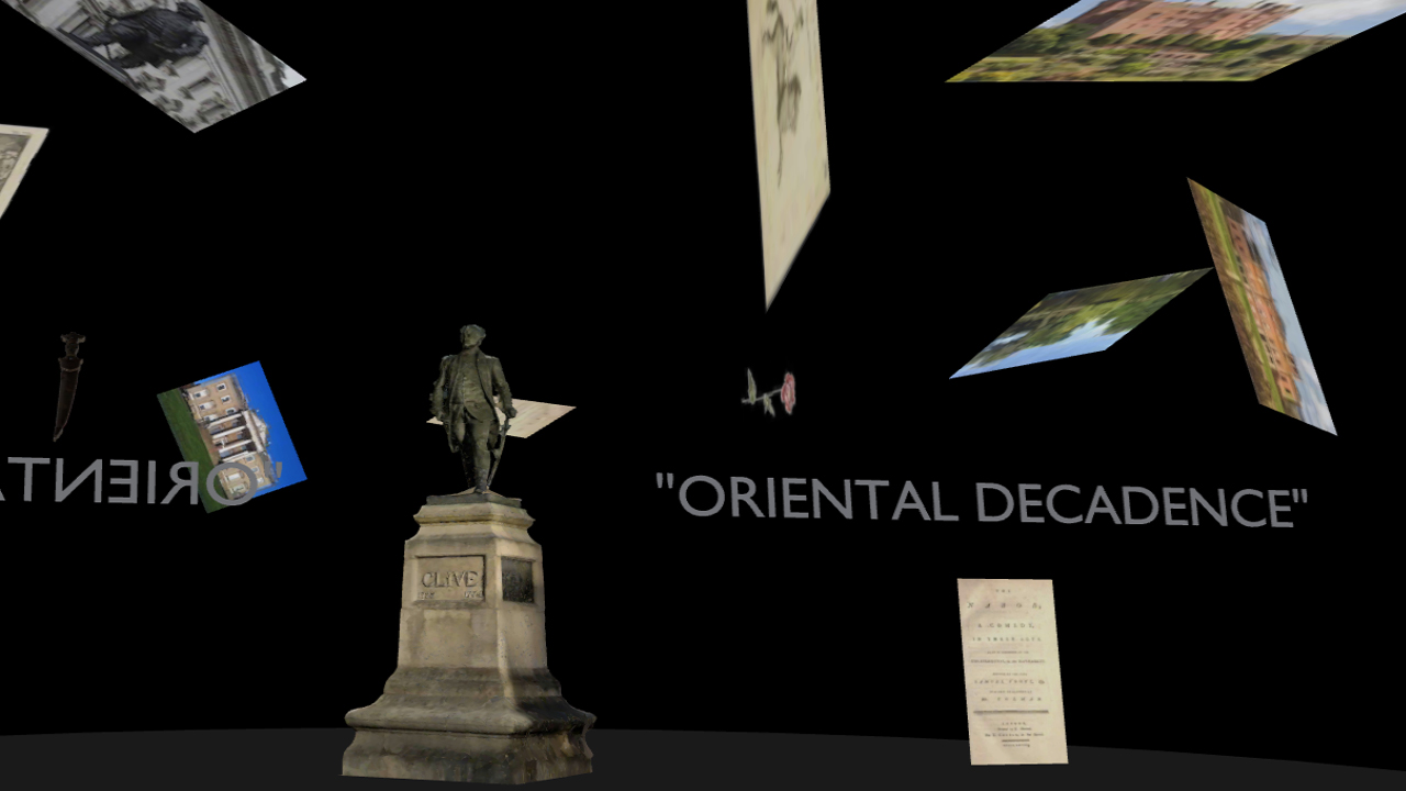 A dark, immersive virtual environment showing a statue of a man on a stone plinth at the centre. Floating around it are angled images and text fragments, including the words “ROBERT CLIVE STATUE by Daniel Trivedy,” “ORIENTAL DECADENCE” appearing partially reversed. The surrounding images include views of greenery, water, and urban scenes, arranged as if suspended in space, creating a fragmented, questioning atmosphere around the monument.