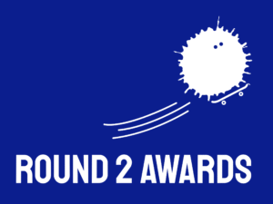 A bright blue background with a splat white character skateboarding across the screen, underneath it text reads Round 2 Awards.