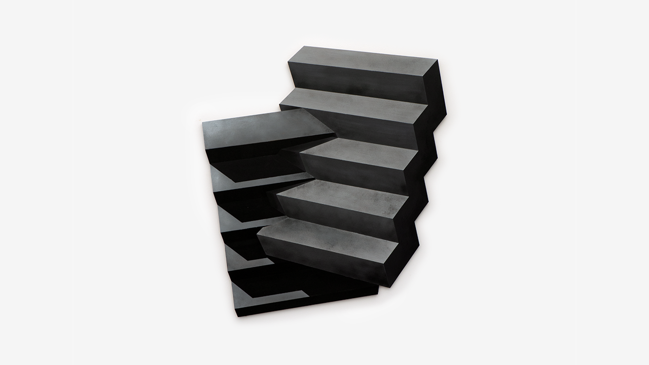 Abstract sculpture: a series of stacked, offset black rectangular blocks creating an illusion of ascending stairs against a white background.